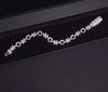 XO moissanite tennis bracelet white gold pave set stones in luxury jewelry packaging