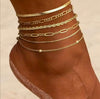 Layered 18K gold anklets stacked on ankle — adjustable gold ankle bracelet set by Twelfth XII