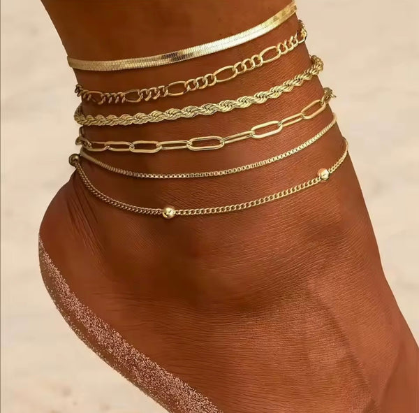Layered 18K gold anklets stacked on ankle — adjustable gold ankle bracelet set by Twelfth XII