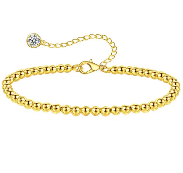 18K gold anklet stack set — 21 layered ankle bracelets including Cuban link, herringbone, tennis, rope, beaded, and leaf chain styles