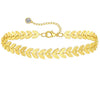 18K gold anklet stack set — 21 layered ankle bracelets including Cuban link, herringbone, tennis, rope, beaded, and leaf chain styles