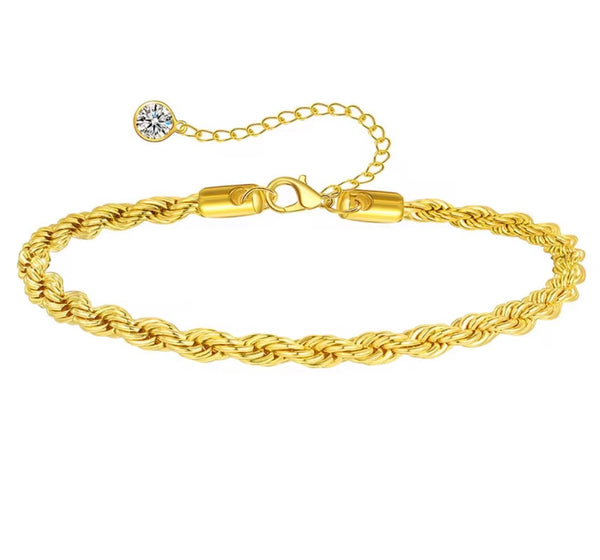 18K gold anklet stack set — 21 layered ankle bracelets including Cuban link, herringbone, tennis, rope, beaded, and leaf chain styles