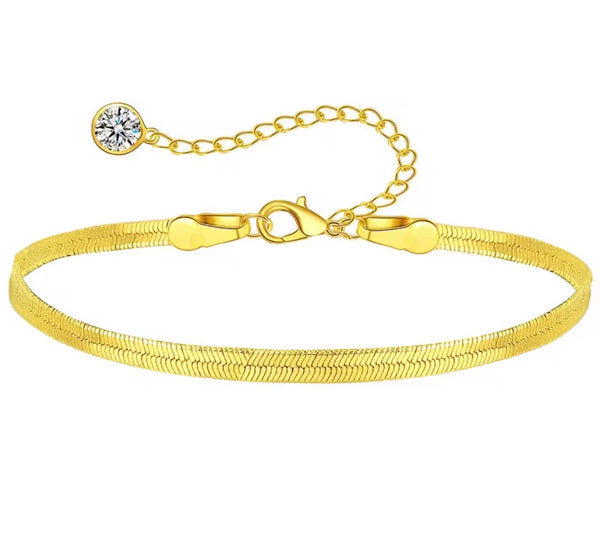 18K gold anklet stack set — 21 layered ankle bracelets including Cuban link, herringbone, tennis, rope, beaded, and leaf chain styles