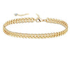 18K gold anklet stack set — 21 layered ankle bracelets including Cuban link, herringbone, tennis, rope, beaded, and leaf chain styles