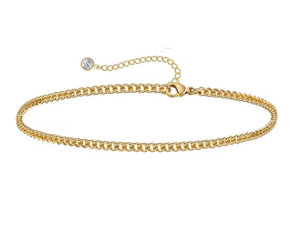 18K gold anklet stack set — 21 layered ankle bracelets including Cuban link, herringbone, tennis, rope, beaded, and leaf chain styles