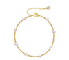 18K gold anklet stack set — 21 layered ankle bracelets including Cuban link, herringbone, tennis, rope, beaded, and leaf chain styles