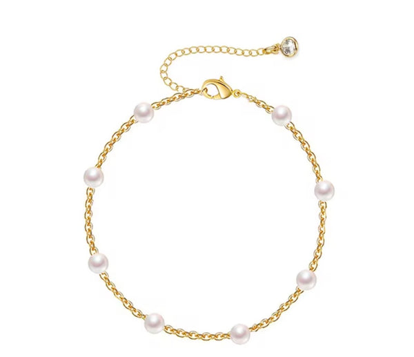 18K gold anklet stack set — 21 layered ankle bracelets including Cuban link, herringbone, tennis, rope, beaded, and leaf chain styles