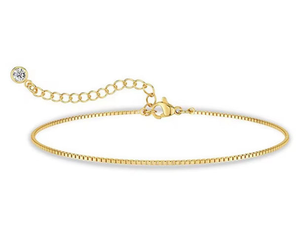 18K gold anklet stack set — 21 layered ankle bracelets including Cuban link, herringbone, tennis, rope, beaded, and leaf chain styles