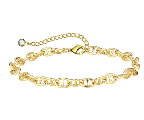 18K gold anklet stack set — 21 layered ankle bracelets including Cuban link, herringbone, tennis, rope, beaded, and leaf chain styles