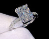 1ct VVS radiant cut moissanite engagement ring in 14K gold PVD-bonded sterling silver pavé setting held in white glove — Twelfth XII