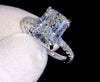 1ct VVS radiant cut moissanite engagement ring in 14K gold PVD-bonded sterling silver pavé setting held in white glove — Twelfth XII