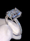 1ct VVS radiant cut moissanite engagement ring in 14K gold PVD-bonded sterling silver pavé setting held in white glove — Twelfth XII