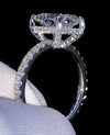 1ct VVS radiant cut moissanite engagement ring in 14K gold PVD-bonded sterling silver pavé setting held in white glove — Twelfth XII