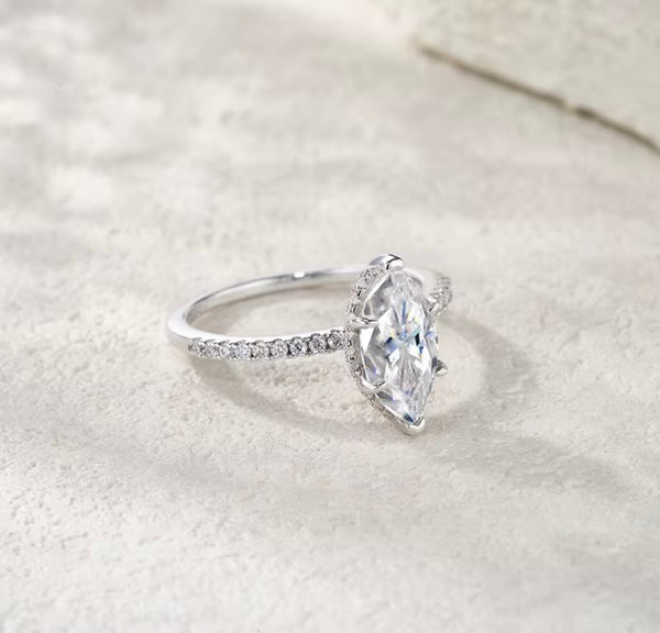1ct marquise cut moissanite engagement ring in S925 sterling silver double-prong pavé setting on white background — Twelfth XII