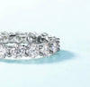 4mm round brilliant moissanite full eternity band in 925 sterling silver shared-prong setting on white background — Twelfth XII wedding band