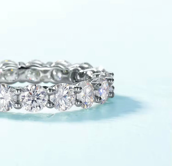 4mm round brilliant moissanite full eternity band in 925 sterling silver shared-prong setting on white background — Twelfth XII wedding band