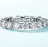 4mm round brilliant moissanite full eternity band in 925 sterling silver shared-prong setting on white background — Twelfth XII wedding band