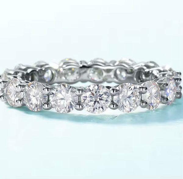4mm round brilliant moissanite full eternity band in 925 sterling silver shared-prong setting on white background — Twelfth XII wedding band