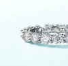 4mm round brilliant moissanite full eternity band in 925 sterling silver shared-prong setting on white background — Twelfth XII wedding band