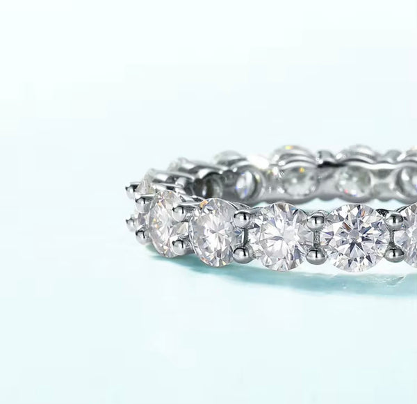 4mm round brilliant moissanite full eternity band in 925 sterling silver shared-prong setting on white background — Twelfth XII wedding band