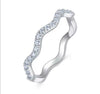 S925 sterling silver wave pavé moissanite curved stackable band on white background — Twelfth XII modern wedding band