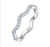 S925 sterling silver wave pavé moissanite curved stackable band on white background — Twelfth XII modern wedding band