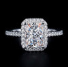 2ct radiant cut moissanite halo engagement ring in S925 sterling silver four-claw pavé setting on dark background — Twelfth XII