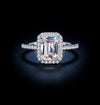 2ct emerald cut moissanite halo engagement ring in S925 sterling silver four-claw pavé setting on dark background — Twelfth XII