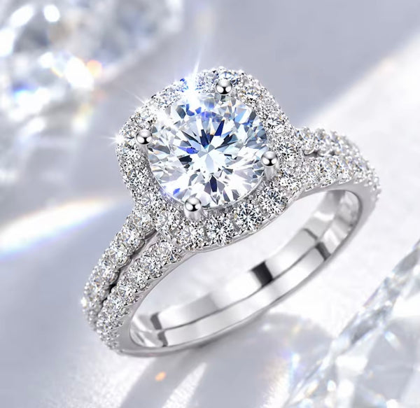 D color VVS1 round moissanite cushion halo split shank engagement ring with matching pavé wedding band in S925 sterling silver on white background — Twelfth XII 2-in-1 bridal set