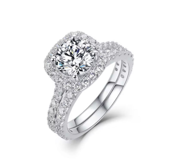 D color VVS1 round moissanite cushion halo split shank engagement ring with matching pavé wedding band in S925 sterling silver on white background — Twelfth XII 2-in-1 bridal set