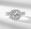 D color VVS1 round moissanite cushion halo split shank engagement ring with matching pavé wedding band in S925 sterling silver on white background — Twelfth XII 2-in-1 bridal set