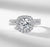 D color VVS1 round moissanite cushion halo split shank engagement ring with matching pavé wedding band in S925 sterling silver on white background — Twelfth XII 2-in-1 bridal set