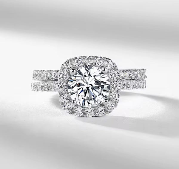 D color VVS1 round moissanite cushion halo split shank engagement ring with matching pavé wedding band in S925 sterling silver on white background — Twelfth XII 2-in-1 bridal set