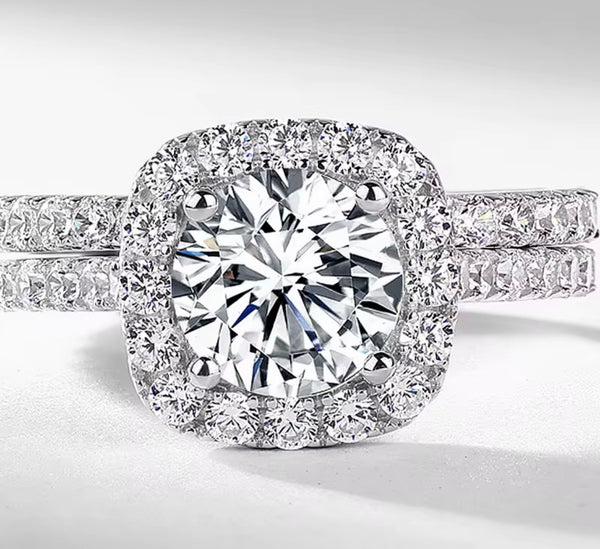 D color VVS1 round moissanite cushion halo split shank engagement ring with matching pavé wedding band in S925 sterling silver on white background — Twelfth XII 2-in-1 bridal set