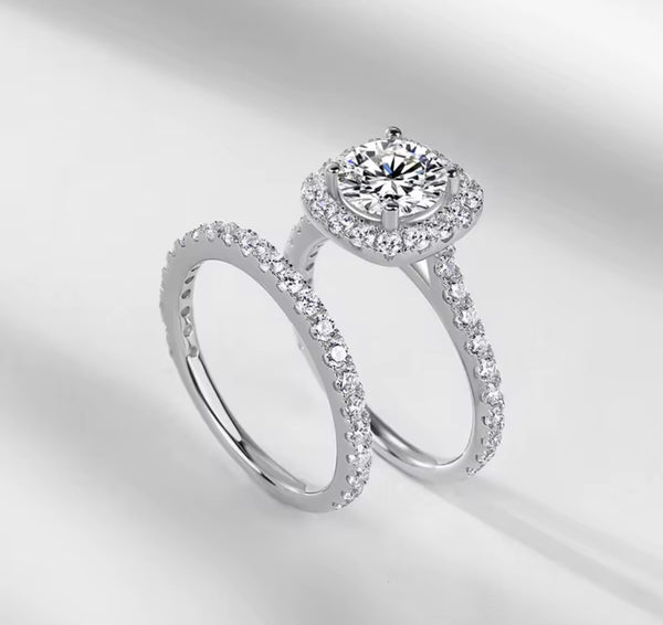 D color VVS1 round moissanite cushion halo split shank engagement ring with matching pavé wedding band in S925 sterling silver on white background — Twelfth XII 2-in-1 bridal set