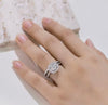 D color VVS1 round moissanite cushion halo split shank engagement ring with matching pavé wedding band in S925 sterling silver on white background — Twelfth XII 2-in-1 bridal set