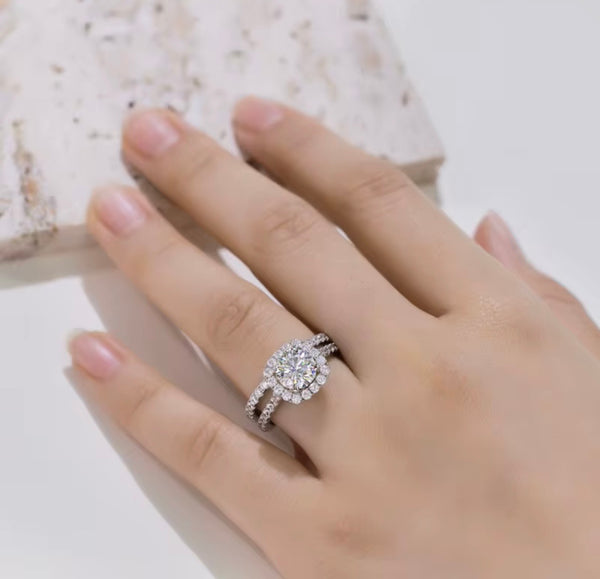 D color VVS1 round moissanite cushion halo split shank engagement ring with matching pavé wedding band in S925 sterling silver on white background — Twelfth XII 2-in-1 bridal set