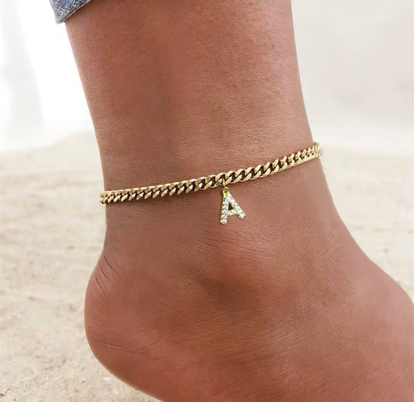 18K gold PVD Cuban link anklet with pavé cubic zirconia initial letter A charm displayed on ankle — personalized gold initial anklet