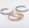 Three iced Cuban link hoop earrings in gold and silver colorways on white background — Twelfth XII luxury jewelry