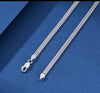 Platinum-bonded sterling silver double Franco chain with lobster clasp closure on blue backdrop