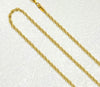 Close-up of 18K solid gold rope chain necklace showing diamond-cut braid detail